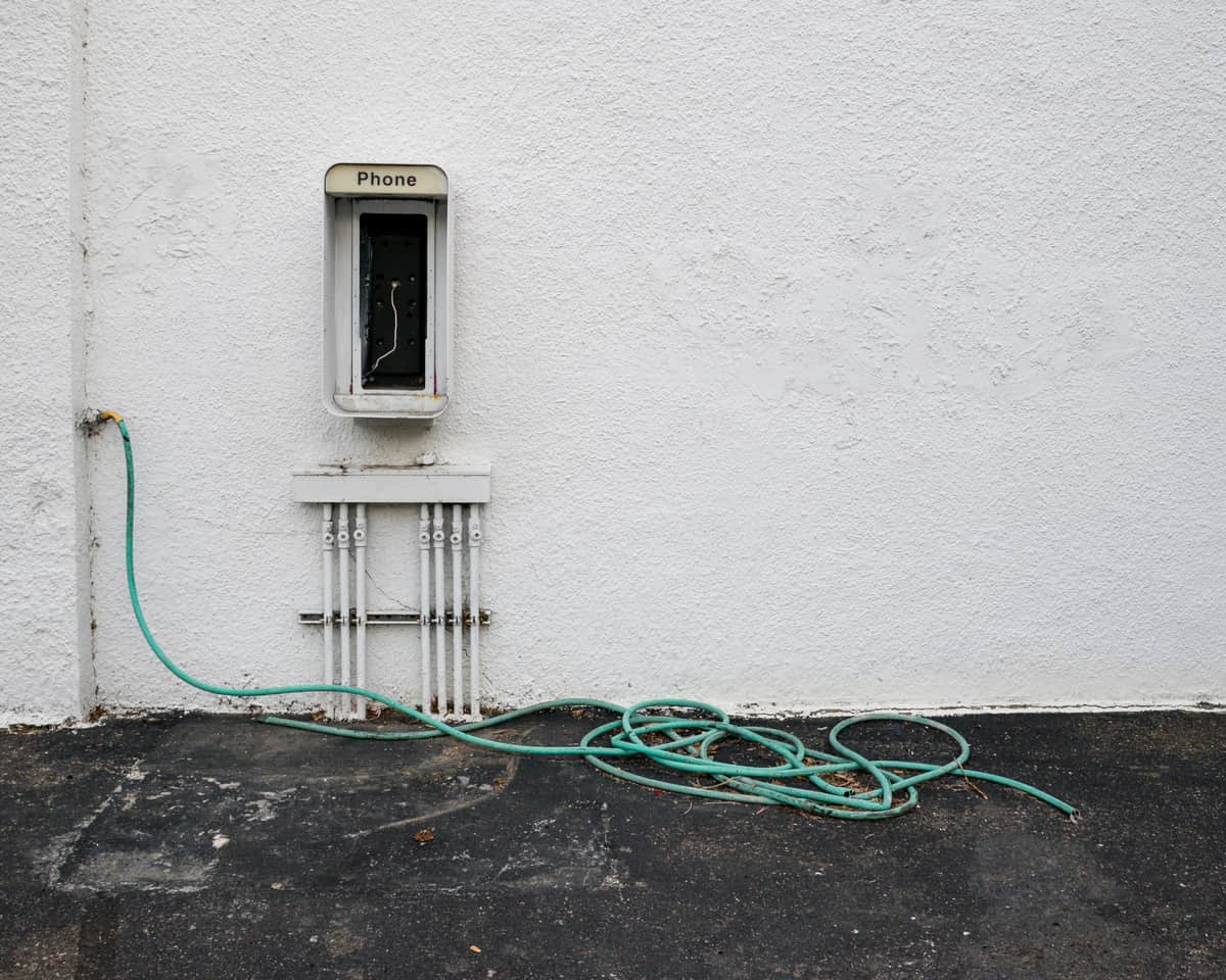 Coiled air hose hanging on a garage wall