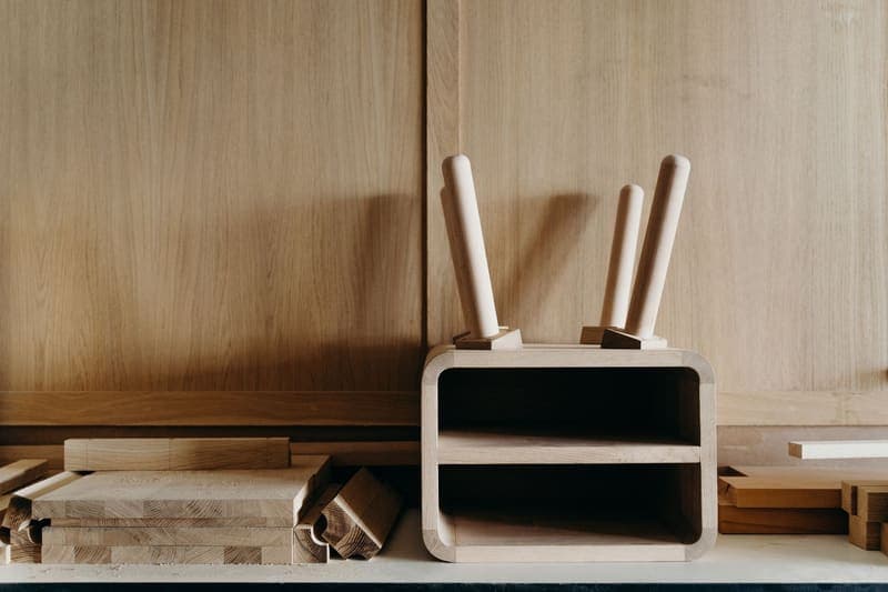 Hand tools and planed wooden boards laid out on a cabinetmaker's bench