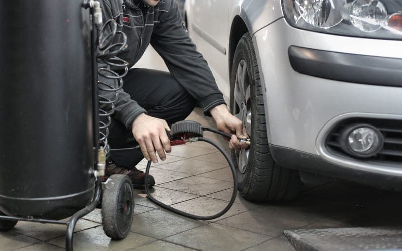 An ultra-quiet oil-free compressor with an aluminum tank and wheels