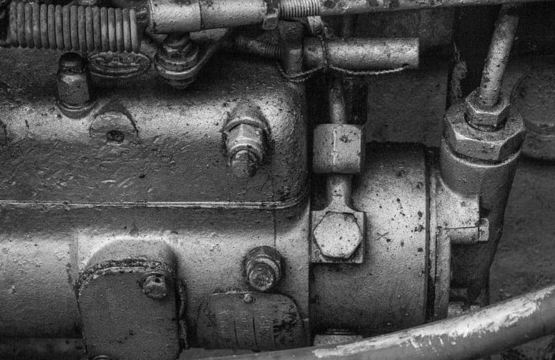 A twin-stack style air compressor in a home garage
