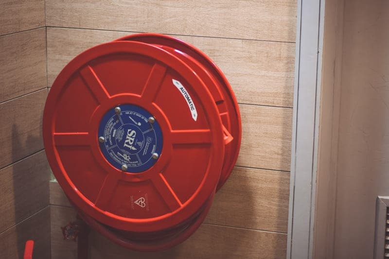 A polypropylene-cased retractable hose reel on a swivel wall bracket