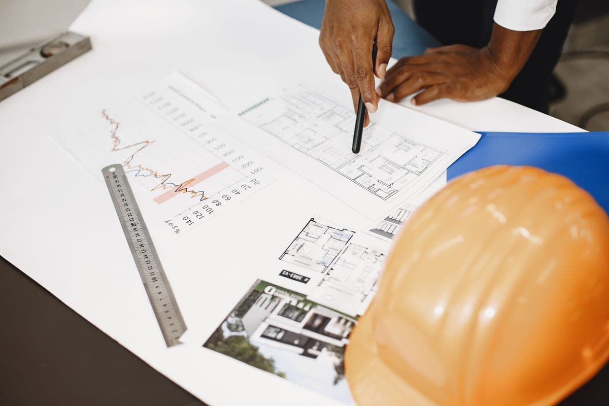 Technical reference charts and notes on a workbench