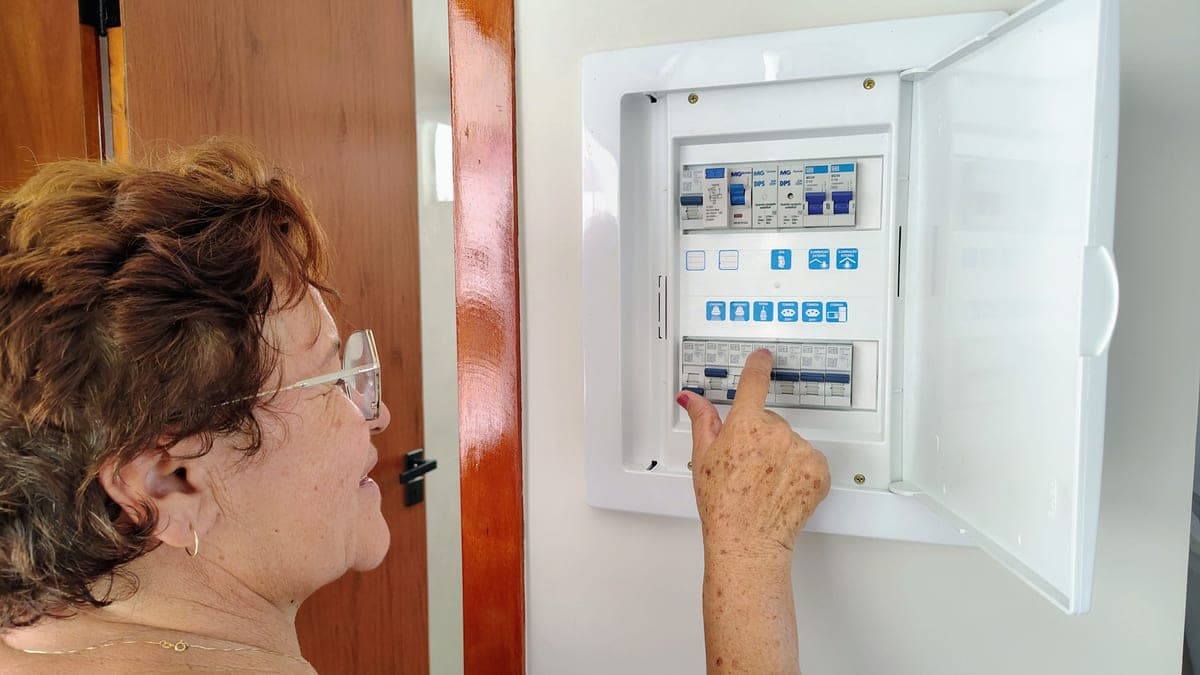 An electrical panel with circuit breakers in a utility space