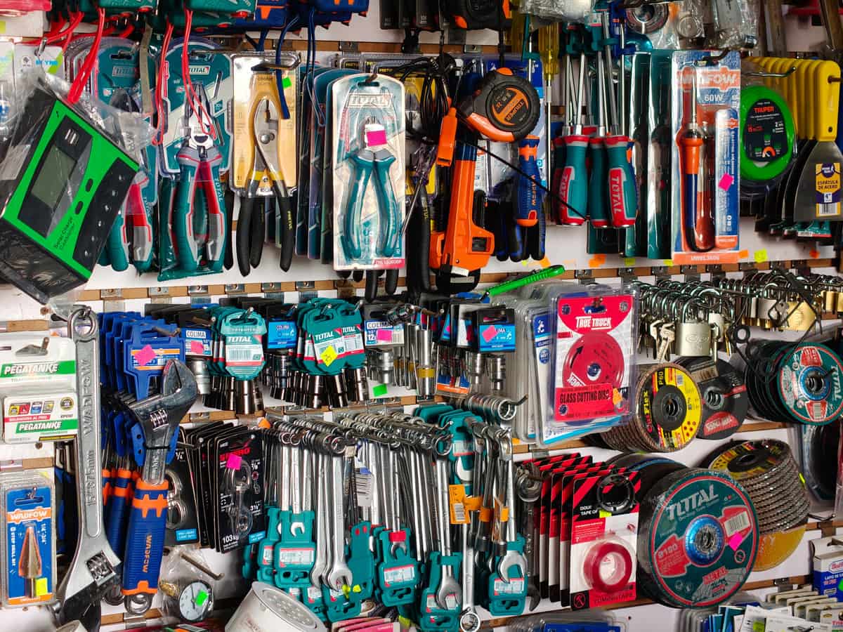 A tool retailer aisle stocked with hand and power tools